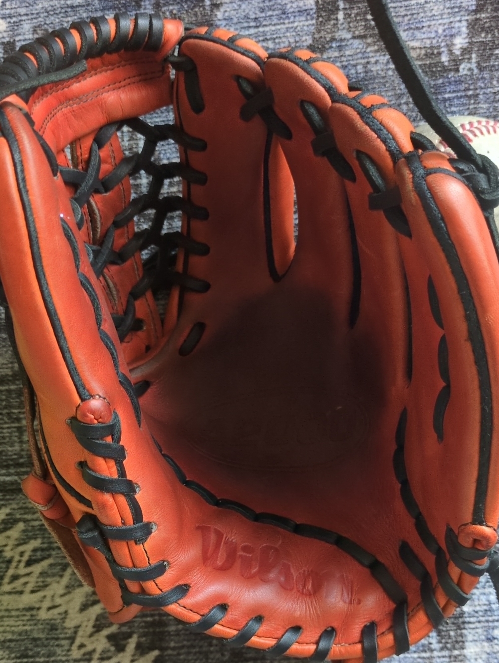 Wilson A2000 Pro Stock 11 3/4 Orange Baseball Glove with New Black Lacing.
